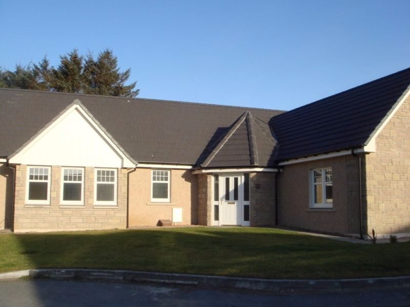 Large bungalow with stone detailing, completed by At Home Construction